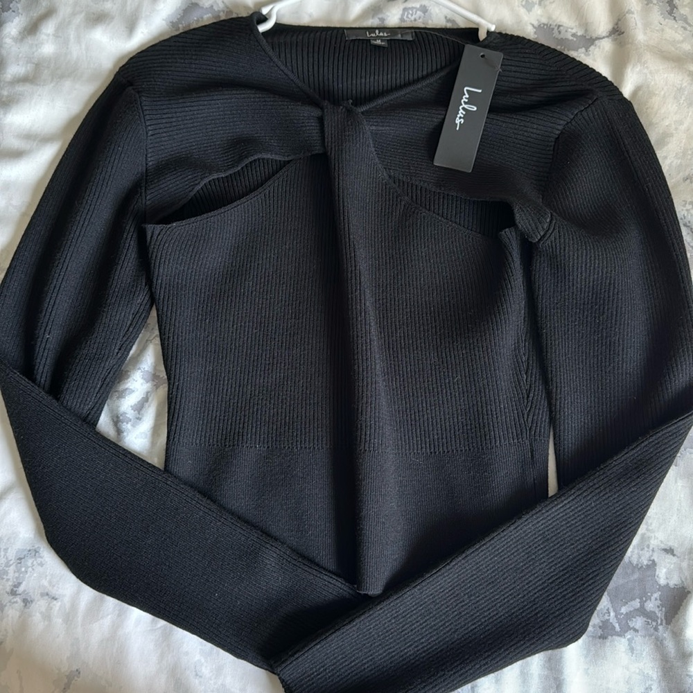 Black sleeve sweater/shirt with detail cut in the middle